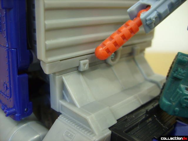 Leader-class Autobot Optimus Prime- vehicle mode (effects activation button pointed out)