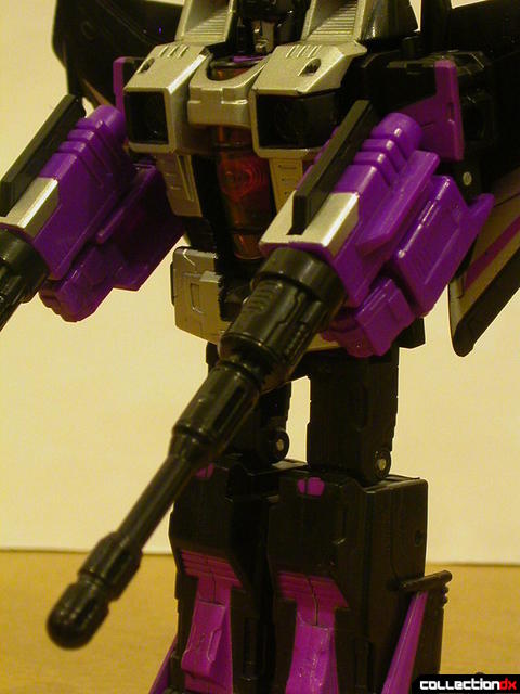 Decepticon Skywarp- robot mode (holding missile launchers in fists)
