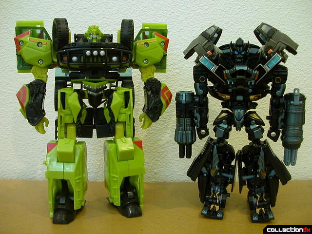 Voyager-class  Ratchet (right, original) and Ironhide (left, Premium repaint) in robot modes