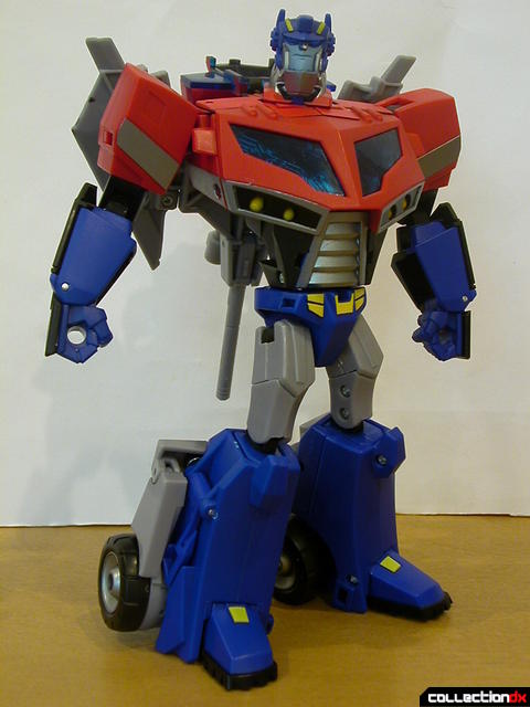Autobot Optimus Prime- robot mode posed with Ion Ax and Water Cannon on back