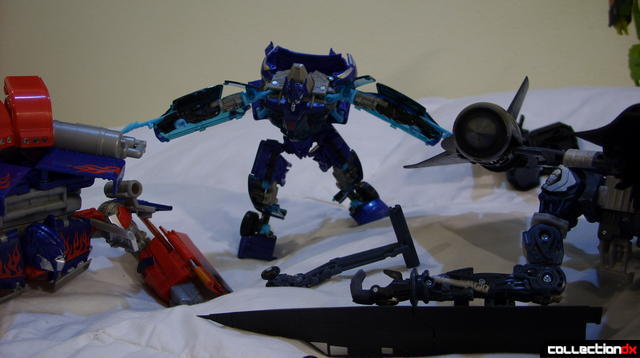 Autobot Jolt (C) combines Optimus Prime (L) with Jetfire (R)